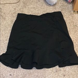 Black mini skirt with flowy trim